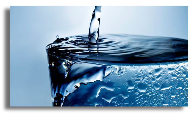 Glass being filled with water to illustrate anxiety