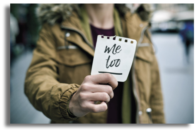Person holding Me Too sign