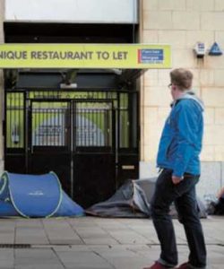 Tents used by homeless people outside an empty retail unit in Cardiff,