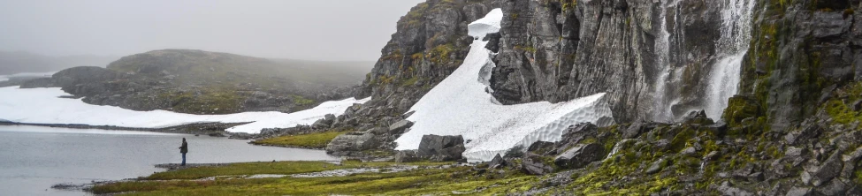Man staring at a Fjord