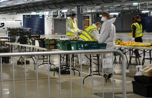 London: A space underneath Tottenham Hotspur Stadium is used as a food hub for delivery of pre- packaged meals to the homeless and vulnerable. Credit: Simon King/Alamy
