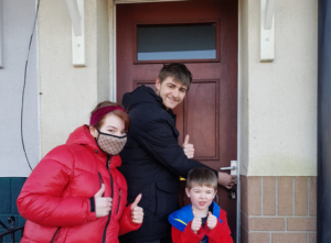 A family entering their new home