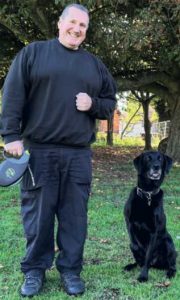Andy Baskett, HM Prison Service national dog trial champion, with Penny, best search dog in the country